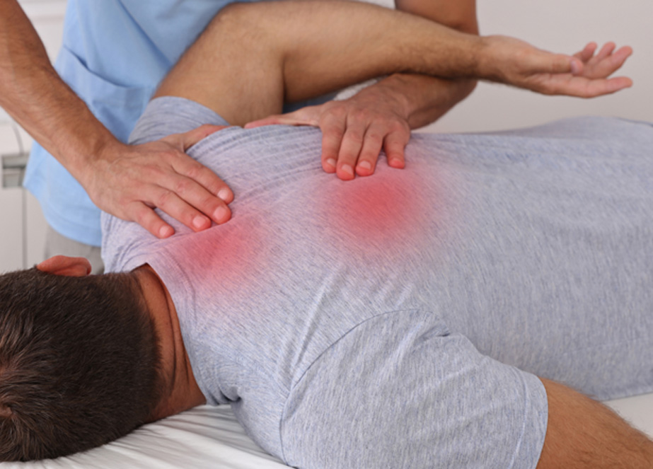 Male-lying-on-his-stomach-and-experiencing-back-pain