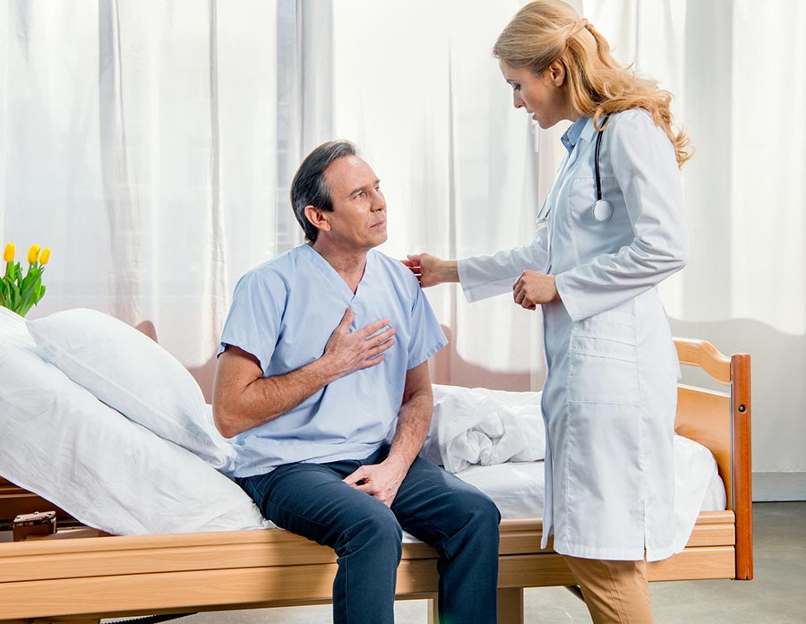 Older-male-speaking-to-a-female-doctor-about-Postherpetic-Shingle-Neuralgia